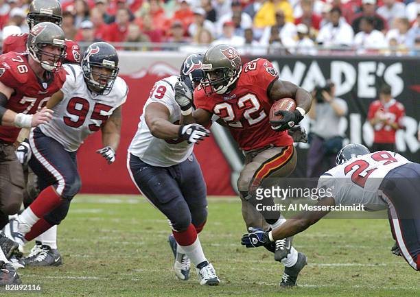 Tampa Bay Buccaneers running back Thomas Jones breaks for a midfield gain against the Houston Texans at Raymond James Stadium, Tampa, Florida,...