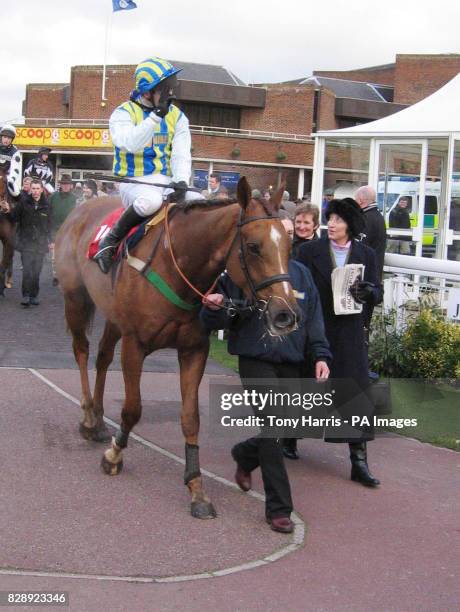 Jim Culloty and Tusk with trainer Miss Henrietta Knight after winning the Pacemaker Magazine Juvenile Novices Hurdle at Kempton Park.