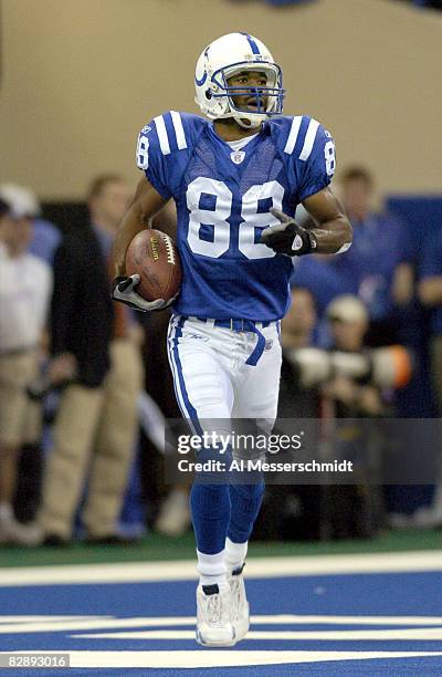 Indianapolis Colts wide receiver Marvin Harrison celebrates a touchdown catch at the RCA Dome, Indianapolis, Indiana, January 4, 2004 in an AFC...