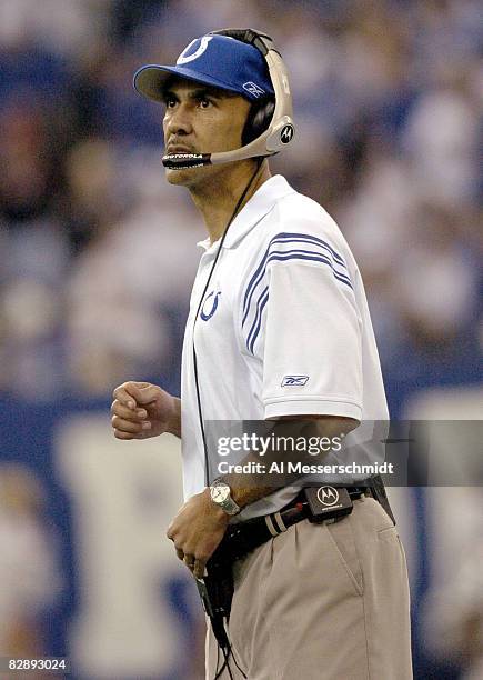 Indianapolis Colts Tony Dungy studies the scoreboard at the RCA Dome, Indianapolis, Indiana, January 4, 2004 in an AFC wildcard playoff game.