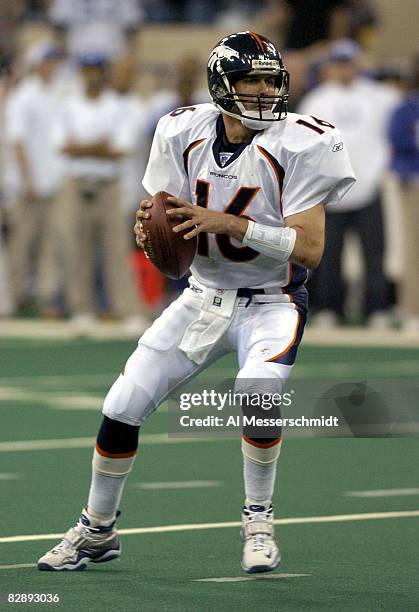 Denver Broncos quarterback Jake Plummer fades to pass at the RCA Dome, Indianapolis, Indiana, January 4, 2004 in an AFC wildcard playoff game.