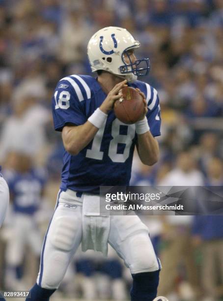 Indianapolis Colts quarterback Peyton Manning fades to pass at the RCA Dome, Indianapolis, Indiana, January 4, 2004 in an AFC wildcard playoff game.