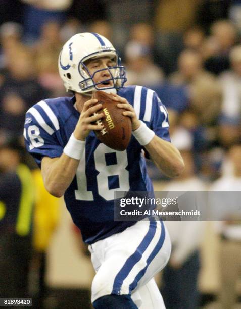 Indianapolis Colts quarterback Peyton Manning fades to pass at the RCA Dome, Indianapolis, Indiana, January 4, 2004 in an AFC wildcard playoff game.