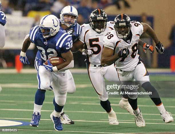 Indianapolis Colts running back Edgerrin James breaking away from Broncos defense during , Indianapolis, in an AFC Wildcard game.January 4, 2004 at...