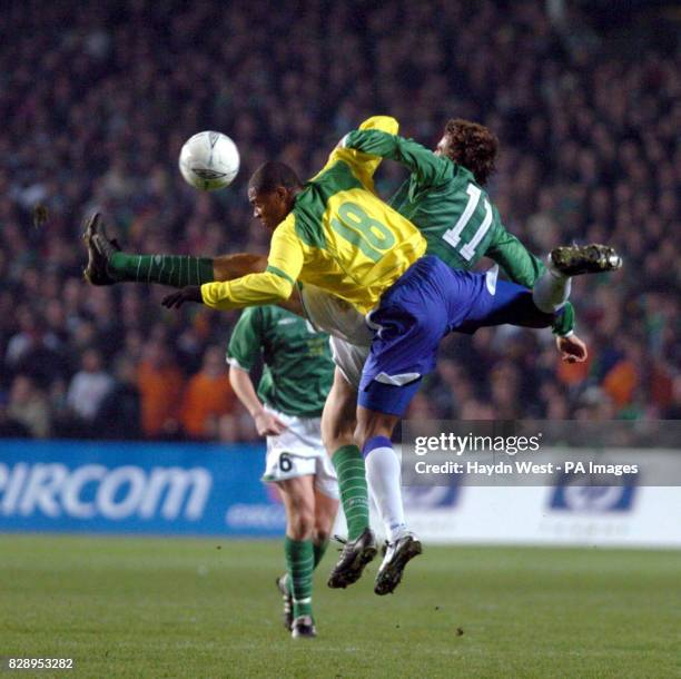 Irelands' Kevin Kilbane contests a header with Brazils' Julio Baptista, during the international friendly match at Lansdowne Road, Dublin. THIS...