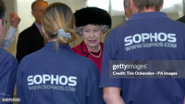 Britain's Queen Elizabeth II meets employess of SOPHOS, a leading computer company specialising in anti-virus technology, during a visit to their...