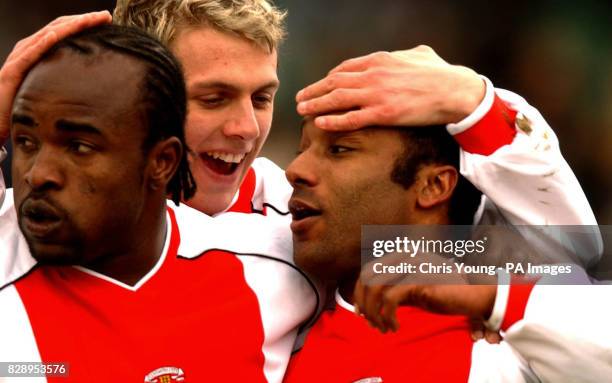 Coventry City's Julian Joachim is congratulated by Stephen Warnock and Patrick Suffo after scoring against Wimbledon during their Nationwide Division...