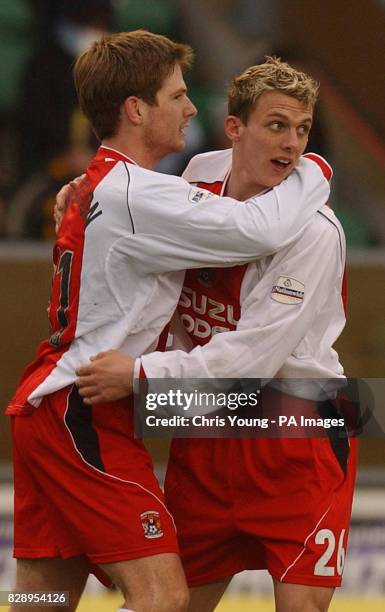 Coventry City's Bjarni Gudjonsson celebrates scoring his side's third goal with team-mate Stephen Warnock, during their Nationwide Division One match...