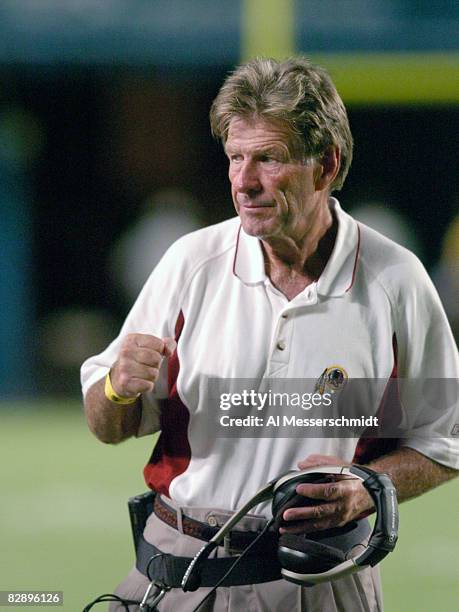 Washington Redskins coach Joe Bugel watches play against the Miami Dolphins August 21, 2004 in Miami.