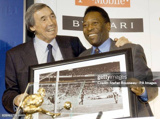 Former International soccer players England goal keeper, Gordon Banks with a picture of his famous save from Brazil striker Pele attend a news...