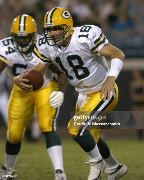 Green Bay Packers quarterback Doug Pederson scrambles against the pass rush during an August 27, 2004 NFL pre-season game against the Jacksonville...