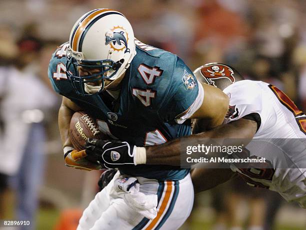 Miami Dolphins fullback Rob Konrad grabs a goalline pass against the Tampa Bay Buccaneers at Raymond James Stadium in a preseason game August 28,...