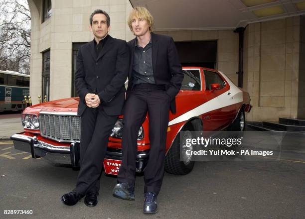 Actors Ben Stiller and Owen Wilson pose with an original Ford Torino during a photocall at The Dorchester Hotel on Park Lane in London, ahead of the...