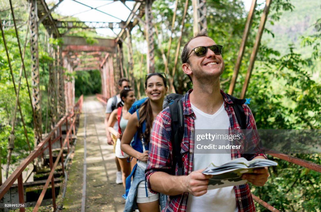 Happy man hiking with a group