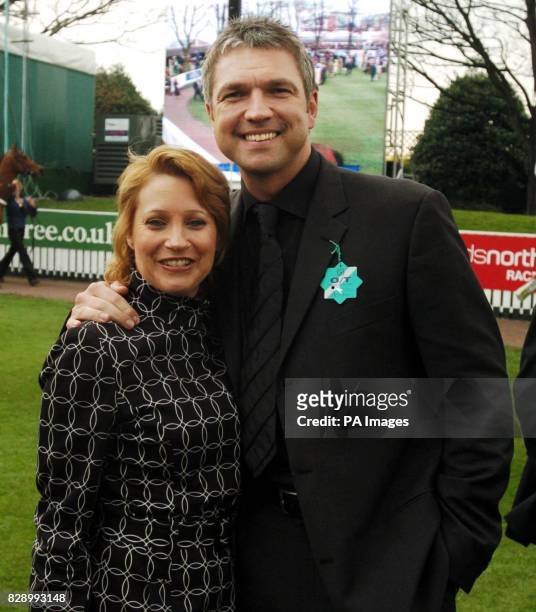 Former footballer Alan Miller and former Emmerdale star Malandra Burrows at Aintree racecourse.