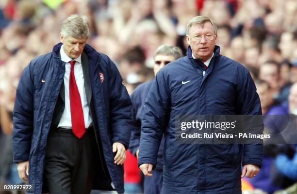 Manchester United manager Sir Alex Ferguson walks off ahead of Arsenal manager Arsene Wenger after beating his team 1-0, during the FA Cup semi final...