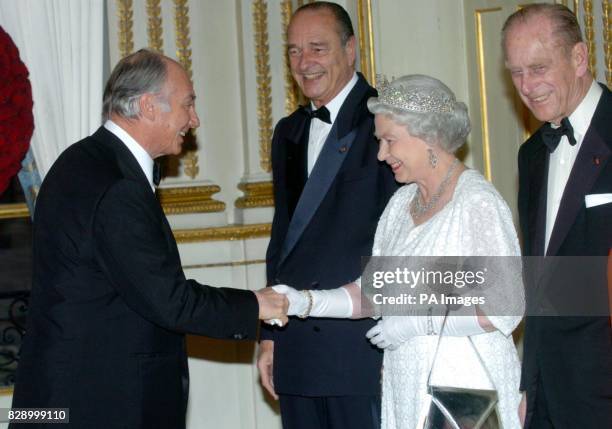 Britain's Queen Elizabeth II greets His Highness the Aga Khan with French President Jacques Chirac and the Duke of Edinburgh at the Elysee Palace, in...