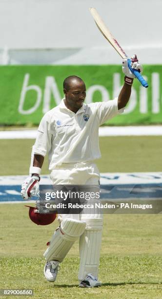 West Indian captain Brian Lara celebrates scoring 400 runs, during the third day of the fourth Test against England at the Recreation ground, St...