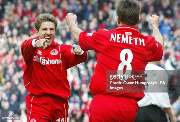 Middlesbrough's Juninho is congratulated by team-mate Szilard Nemeth after scoring against Southampton during the Barclaycard Premiership match at...