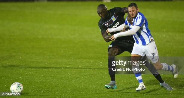 Drey Wright of Colchester United tussle with Aston Villa's Christopher Samba during Carabao Cup First Round match between Colchester United and Aston...