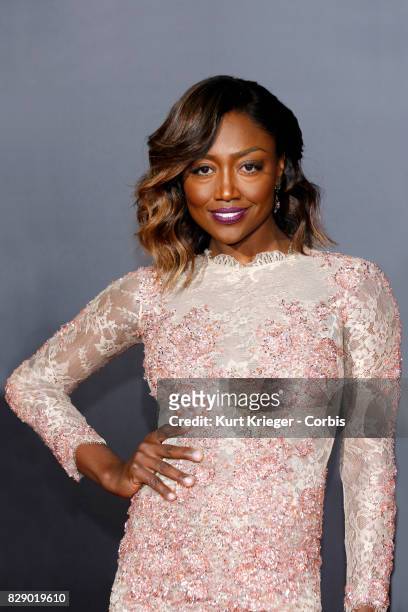 Image has been digitally retouched.) Patina Miller arrives at the 'Hunger Games - Mockingjay Part 2' premiere in Los Angeles, CA on November 16, 2015.