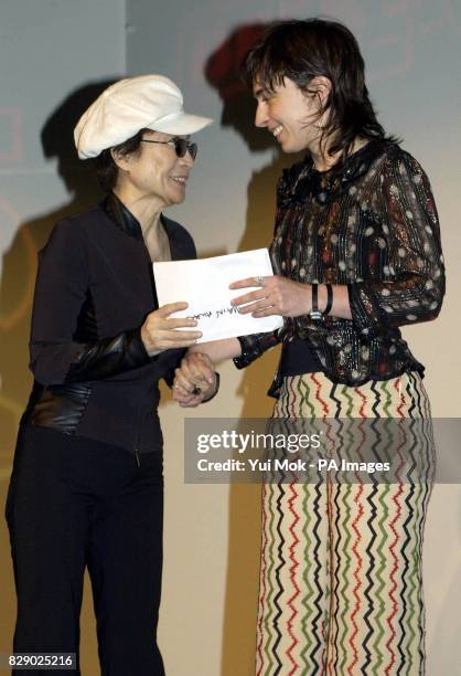 Artist/composer Yoko Ono presents artist Saskia Olde Wolbers the Beck's Futures 2004 award - the UK's richest art prize - at ICA The Mall in central...