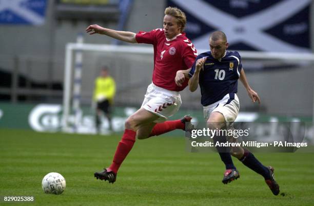 Scotland's James McFadden challenges Denmark's Martin Laursen during the Denmark vs Scotland international football friendly match at the Parken...