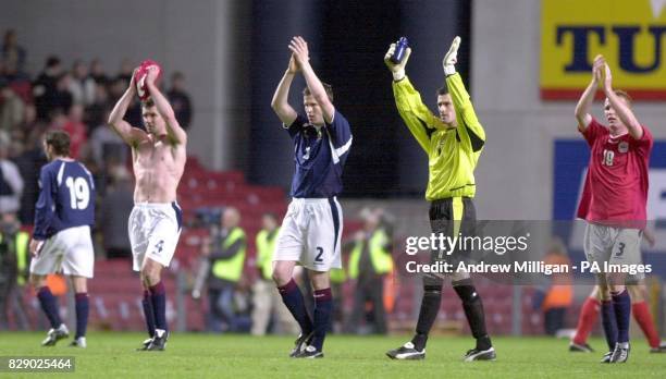 Dejected Scotland players leave the pitch, after the Denmark vs Scotland international football friendly match at the Parken Stadium, Copenhagen.