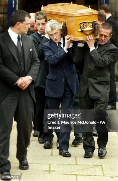 Family and friends of Kriss Donald carry his coffin from the Church of Jesus Christ of Latter Day Saints, in Pollock, Glasgow.