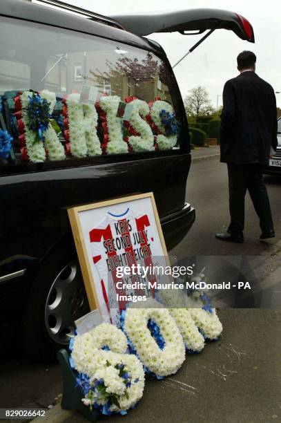 Flowers left by family and friends of Kriss Donald during his funeral service at the Church of Jesus Christ of Latter Day Saints, in Pollock,...