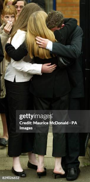 Family and friends of Kriss Donald mourn together during the funeral service at the Church of Jesus Christ of Latter Day Saints, in Pollock, Glasgow....