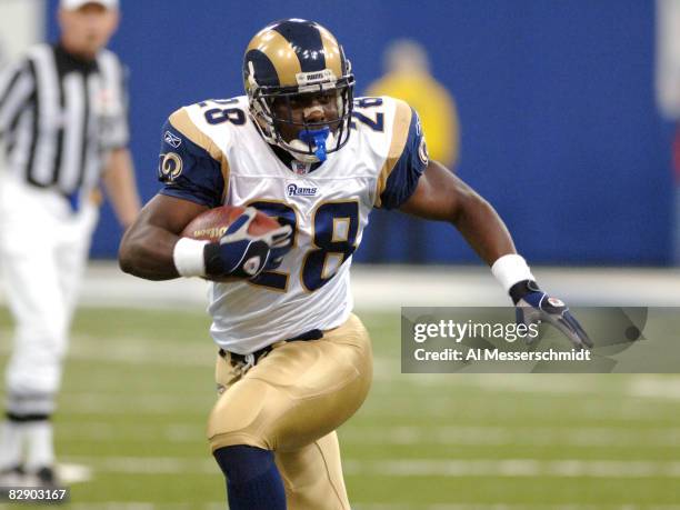 St. Louis Rams running back Marshall Faulk rushes upfield against the Indianapolis Colts, October 17, 2005 in Indianapolis. The Colts defeated the...