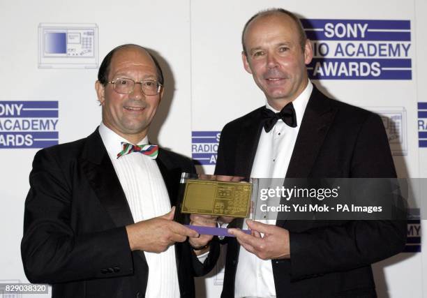 England rugby coach Clive Woodward presents Radio 5 Live commentator Ian Robertson with the 2003 Award during the Sony Radio Academy Awards 2004,...