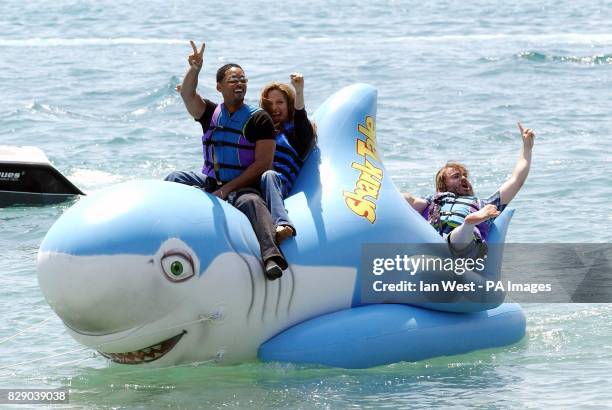 Actors Will Smith , Angelina Jolie and Jack Black ride a inflatable shark during a photocall for the new animated film Shark Tale, where they provide...