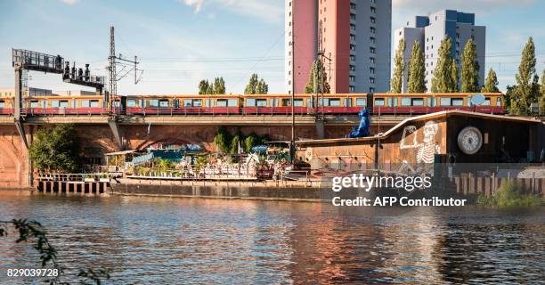 Picture taken on August 9, 2017 shows the club "Kater Blau" part of the urban cooperative project Holzmarkt 25 on the banks of the river Spree in...