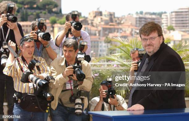 Author and film-maker Michael Moore poses for photographers during a photocall to promote his new movie Farenheit 9/11 at the Palais de Festival...