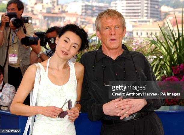 Maggie Cheung and Nick Nolte pose for photographers during the photocall for 'Clean' at the Riveria Terrance in the Palias du Festival during the...