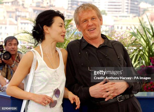 Actors Maggie Cheung and Nick Nolte pose for photographers during a photocall to promote their new movie 'Clean' at the Palais de Festival during the...