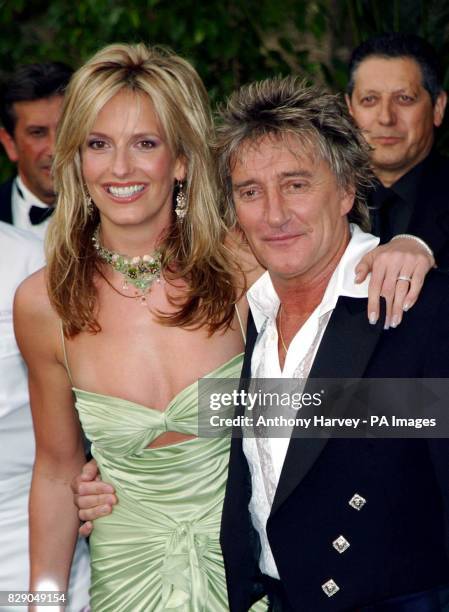 Singer Rod Stewart and his girlfriend Penny Lancaster arrive for the amfAR 'Cinema Against AIDS 2004' party at the Le Moulin de Mougins restaurant,...