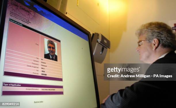 Home Office Minister Des Browne, MP having a Biometric identity card made at the DVLA office in Glasgow. The Government intends to introduce a...