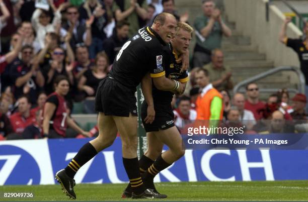 Wasps captain Lawrence Dalaglio congratulates Stuart Abbott, scorer of his side's opening try against Toulouse during the Heineken Cup Final at...