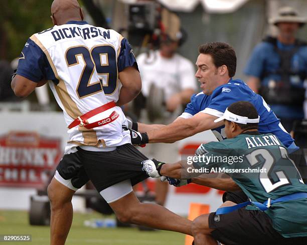 Jason Sehorn and Eric Allen tackle Eric Dickerson during an alumni air it out flag football game February 10 before the 2006 Pro Bowl in Honolulu.