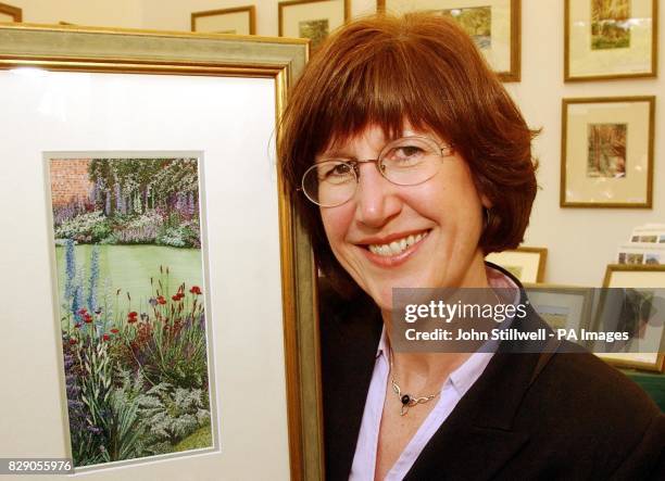 Mrs Alison Holt from Oswestry in Shropshire, with some of her original machine embroideries on her stand at the Chelsea Flower show, in Central...