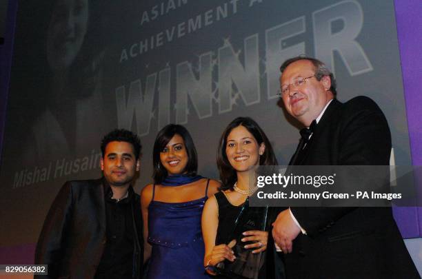 Eastenders stars Ameet Chana and Pooja Shah, with Mishal Husain from London, winer of the Young Achiever of the Year Award at the Asian Women of...