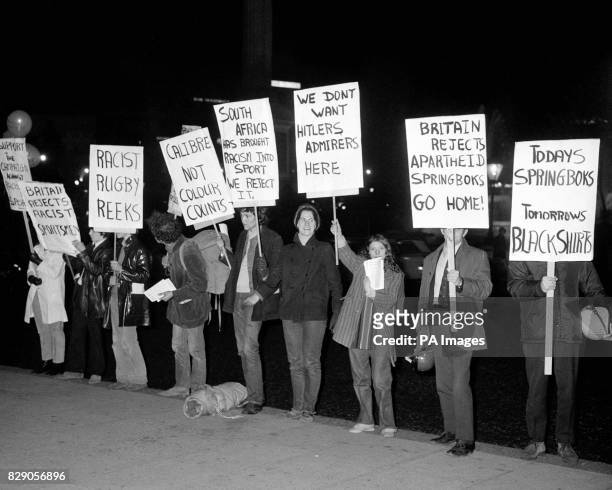 Anti-Apartheid protestors with placards outside the South African Embassy in Trafalgar Square, London, where the South African Ambassador Dr. Hendrik...