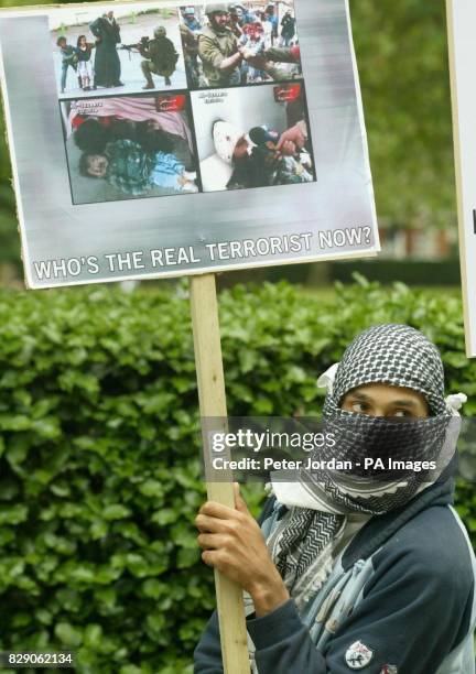 Muslim protester outside the American Embassy. Demonstrators handed out flyers saying "It is now apparent that Muslims are being persecuted due to...