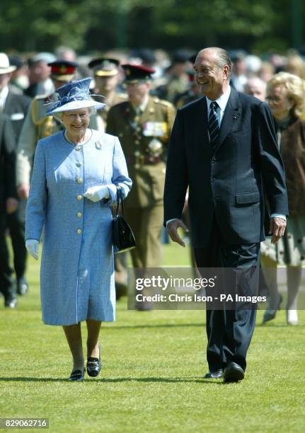 Britain's Queen Elizabeth II and President Jacques Chirac of France attend a cermony of commemoration at the Commonwealth War Graves Cemetary in...