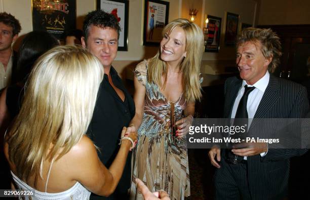 Actor Shane Richie and his girlfriend Christie Goddard meet Penny Lancaster and Rod Stewart before the charity performance of Ben Elton's 'Rod...