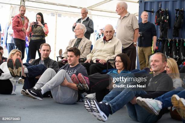 Veterans Fred Glover , Ted Pieri and Dick Carpenter watch as a basic lesson takes place ahead of their skydive, at the Old Sarum airfield on August...