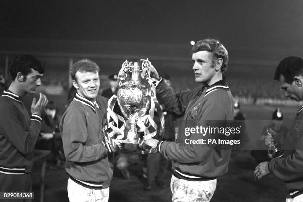 Leeds United captain Billy Bremner and goalkeeper Gary Sprake showing the League Championship Cup to the crowd at Elland Road.